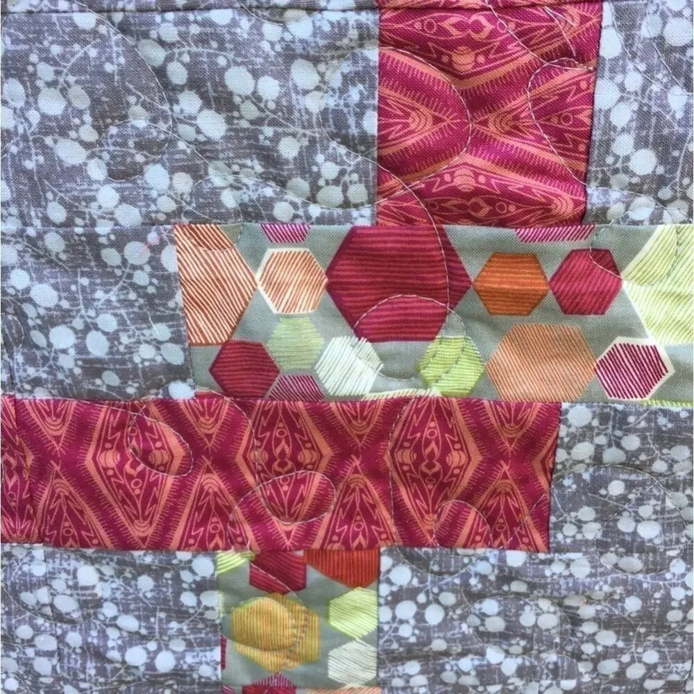 Quilt by me Ruth twisted pretzel is the pattern. Size is 76”-84” Machine quilted